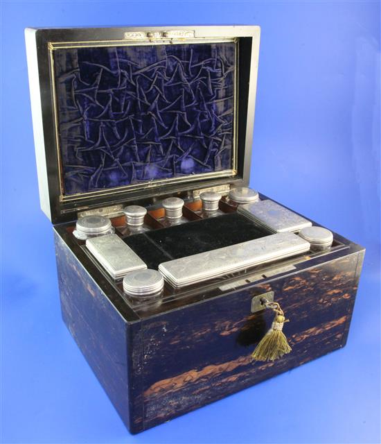 A Victorian coromandel wood toilet box with ten silver mounted jars, 12in.